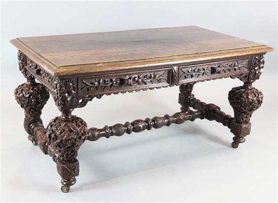 A Victorian carved oak library table, in the manner of Richard Bridgens, 4ft 11in x 2ft 9in. H.2ft 6in.